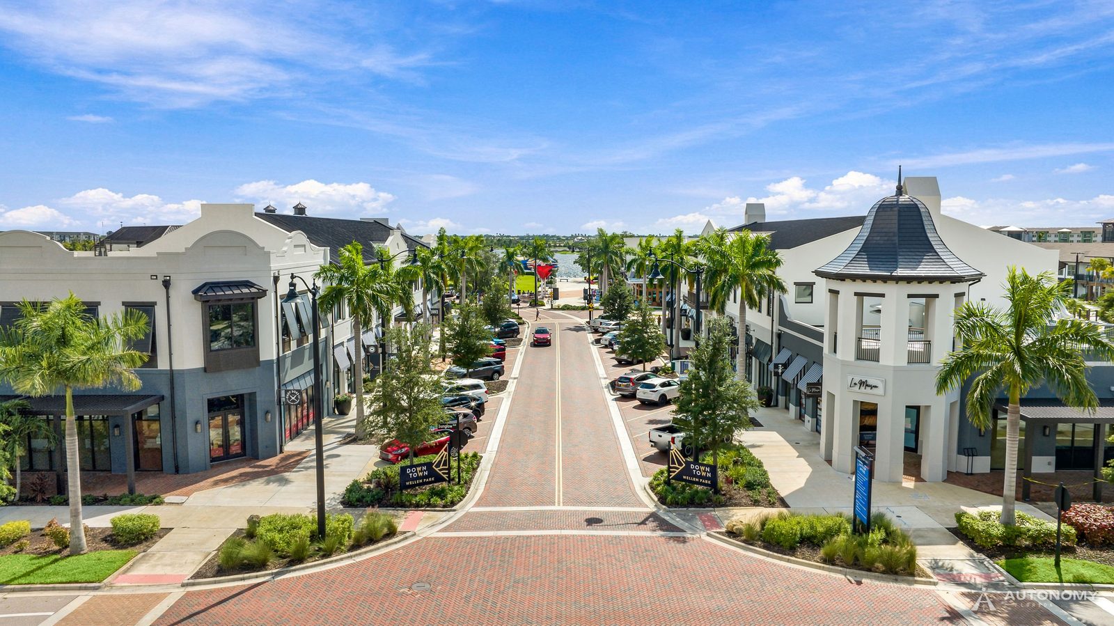 Aerial view down Main Street in Downtown Wellen, lined with palms, shops and restaurants, Wellen Park, Venice FL